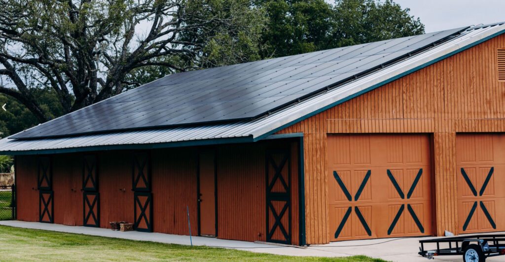 Garage with solar panels on roof.