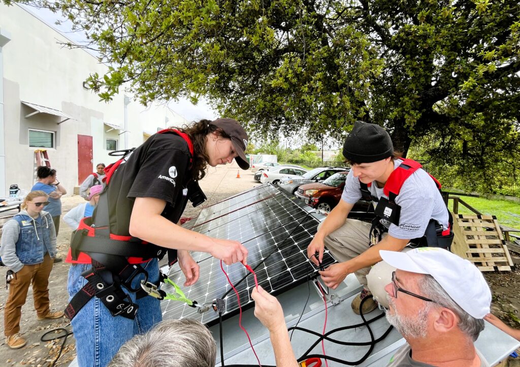 Students working on solar panel