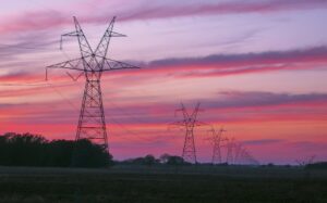 Transmission towers and lines at sunset in East Texas