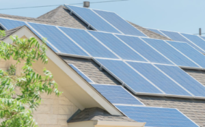 House with rooftop solar panels.