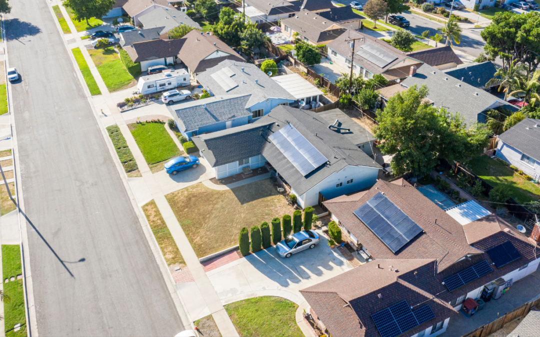 Aerial view of homes with rooftop solar.