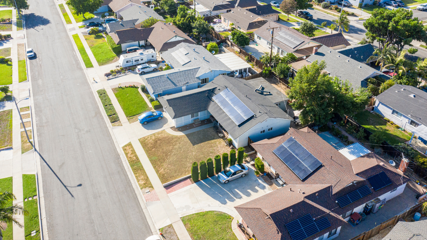 Aerial view of homes with rooftop solar.